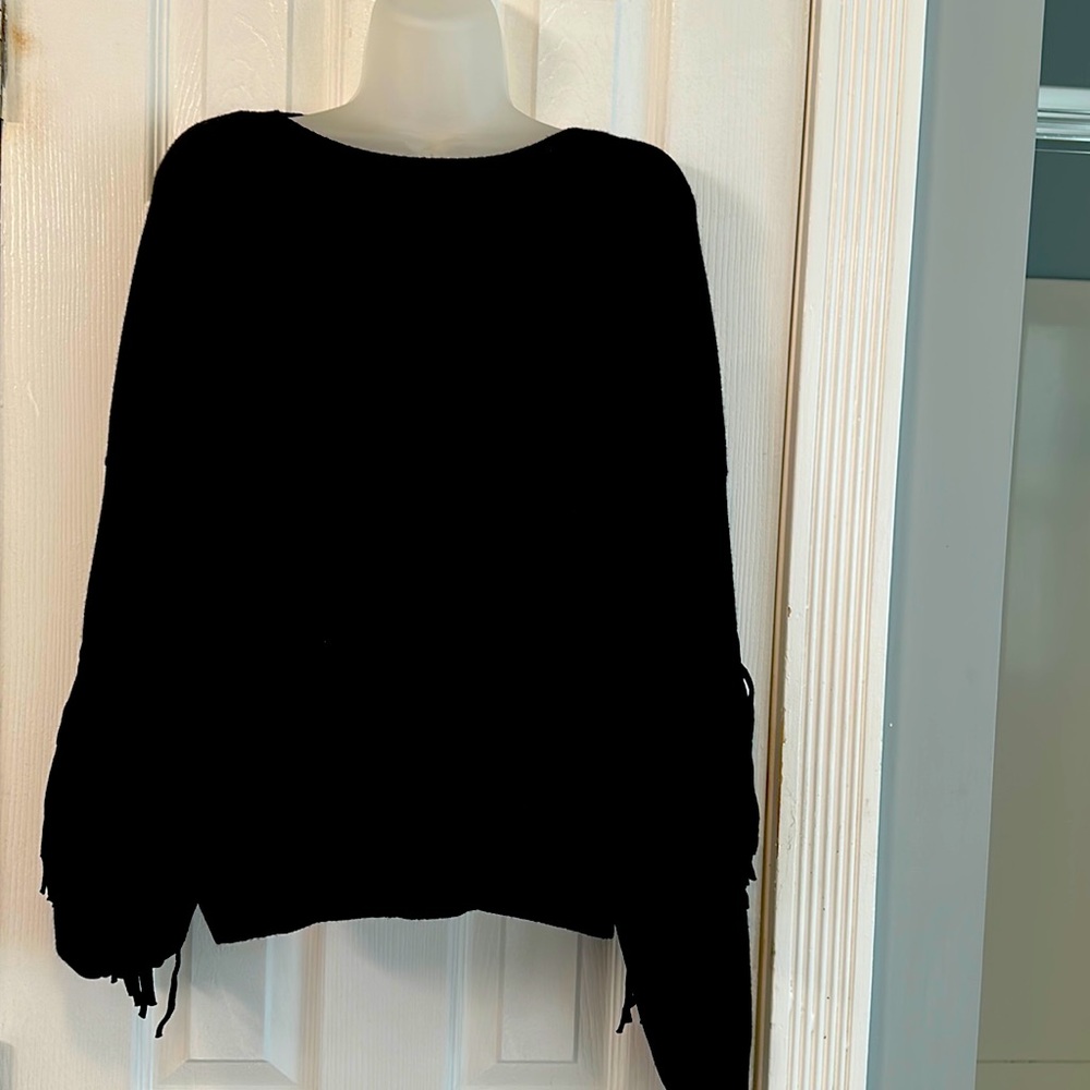 Aqua fringed sweater.